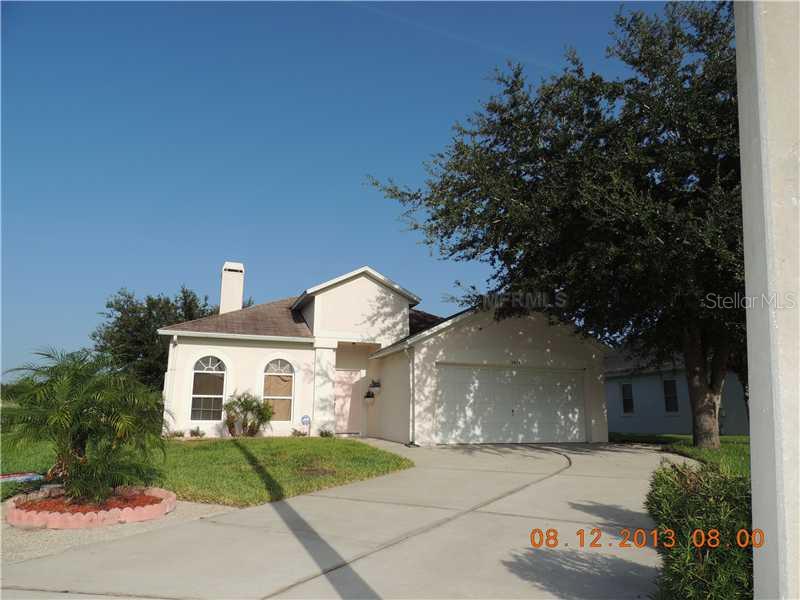 2979 Krista Key Circle Orlando, FL 32817 - Photo 1 of 1 a front view of a house with garden