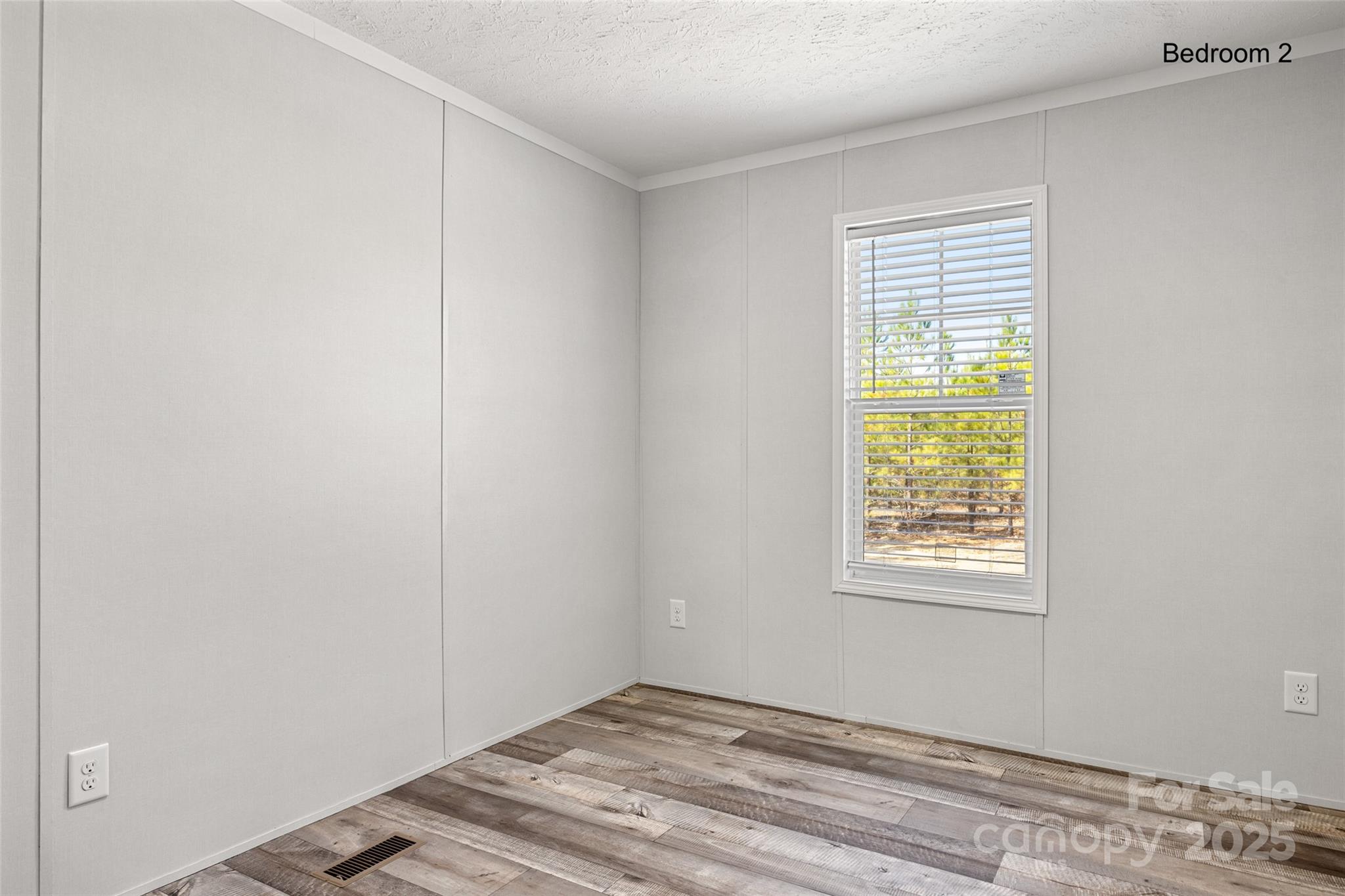596 Jack Bone Hill Road Jefferson, SC 29718 - Photo 17 of 27 an empty room with a window