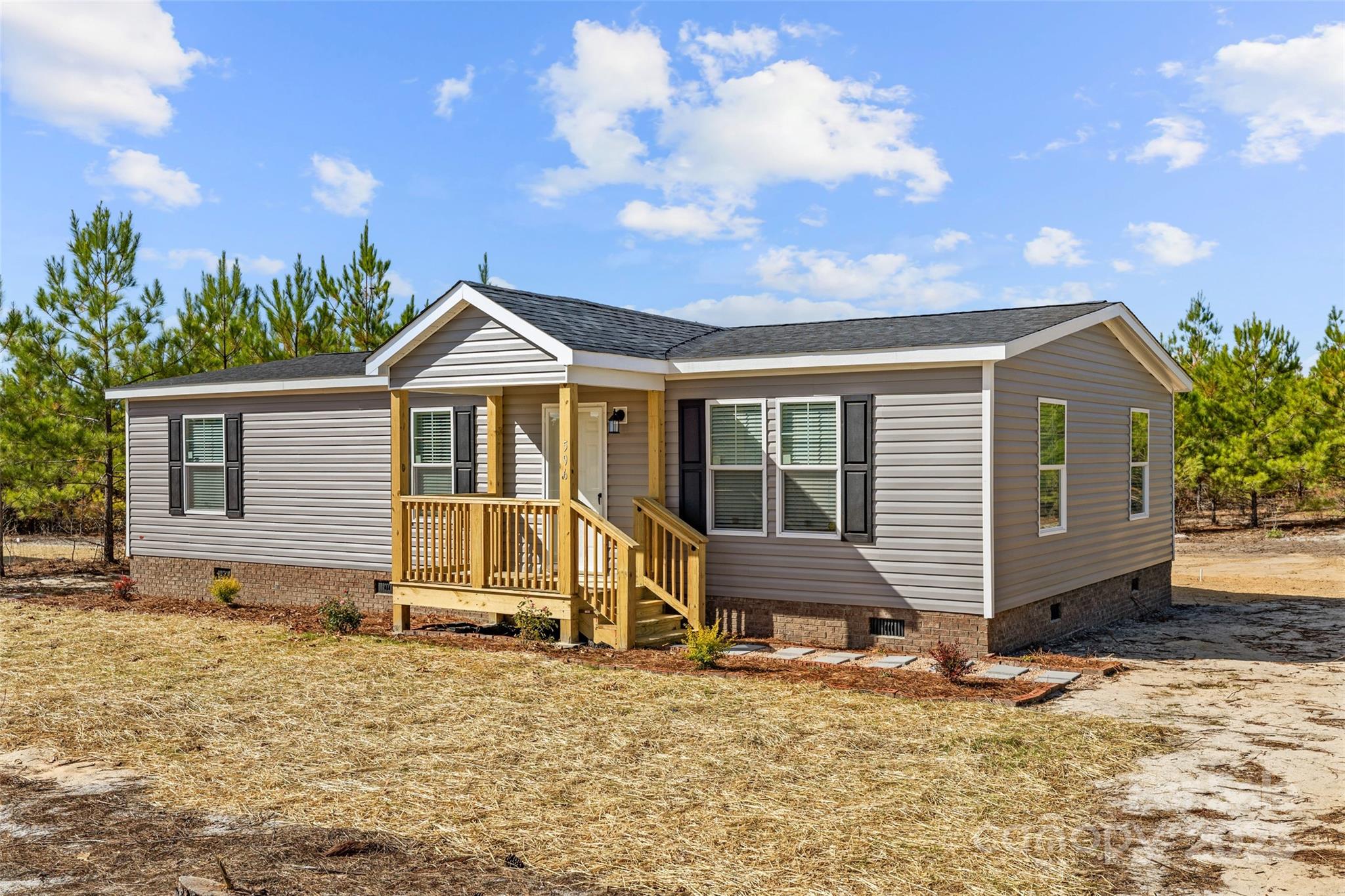 596 Jack Bone Hill Road Jefferson, SC 29718 - Photo 22 of 27 a front view of a house with a yard