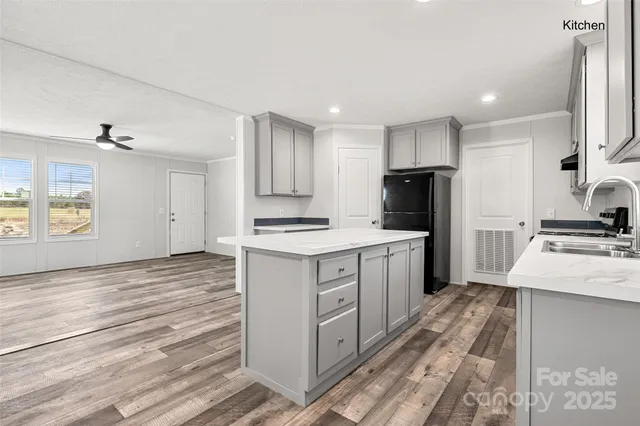 a kitchen with a refrigerator stove and sink
