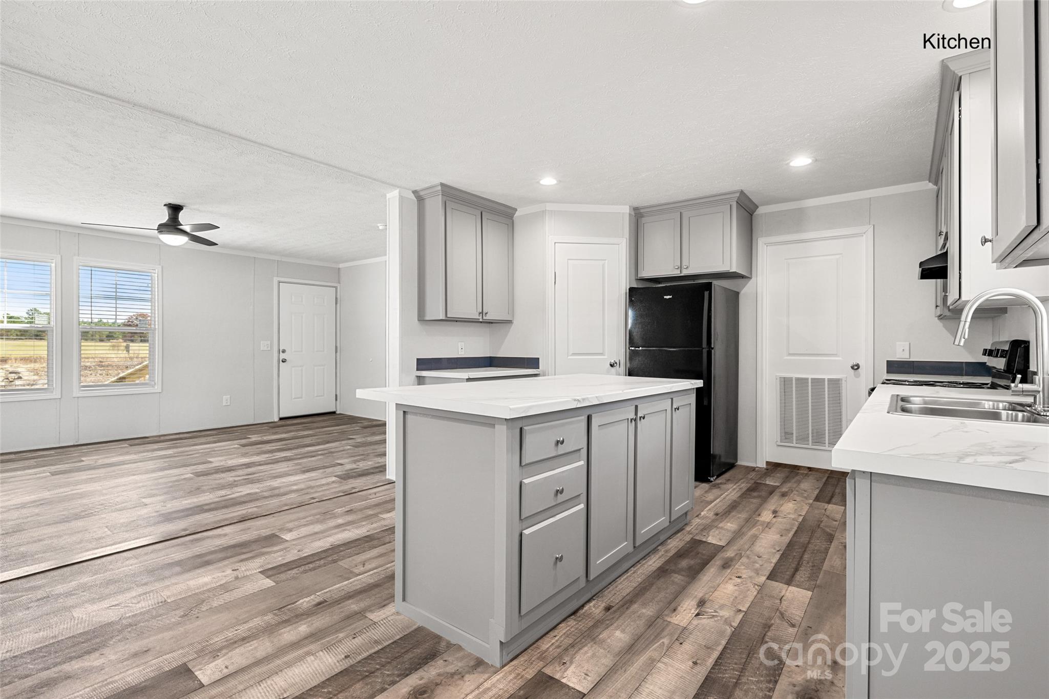 596 Jack Bone Hill Road Jefferson, SC 29718 - Photo 5 of 27 a kitchen with a refrigerator stove and sink