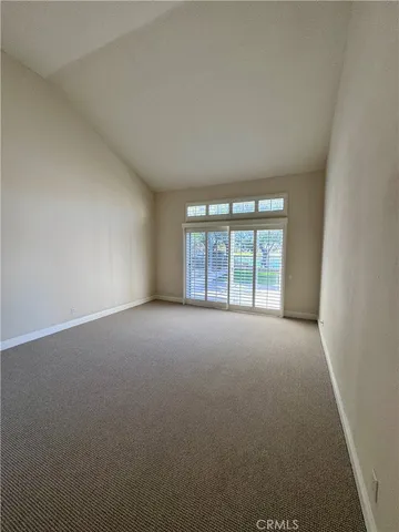 a view of a room with shelf on the wall