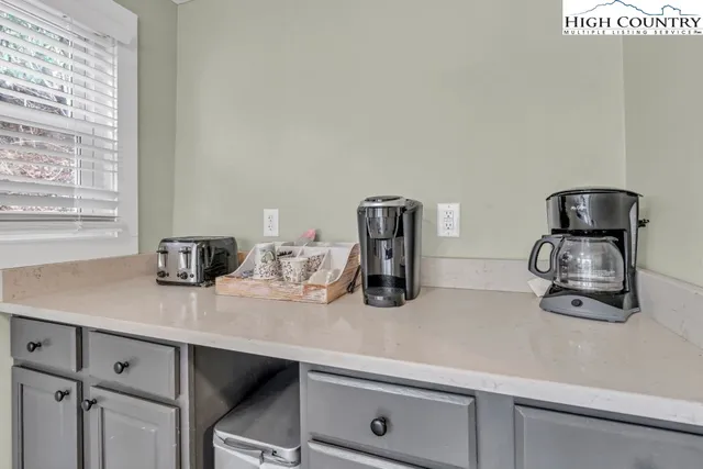 a kitchen with sink cabinets and appliances