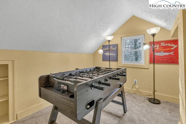 a kitchen that has a stove and a table