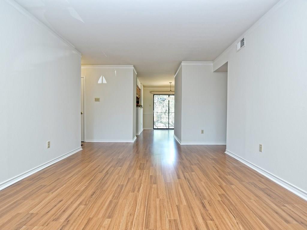 4159 Steck Avenue, Unit 278 Austin, TX 78759 - Photo 11 of 30 Unfurnished room with light wood-type flooring and ornamental molding