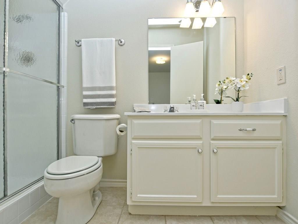 4159 Steck Avenue, Unit 278 Austin, TX 78759 - Photo 17 of 30 Bathroom with vanity, a stall shower, and light tile patterned floors