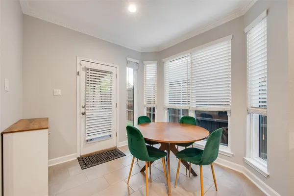 a view of a room with furniture and wooden floor