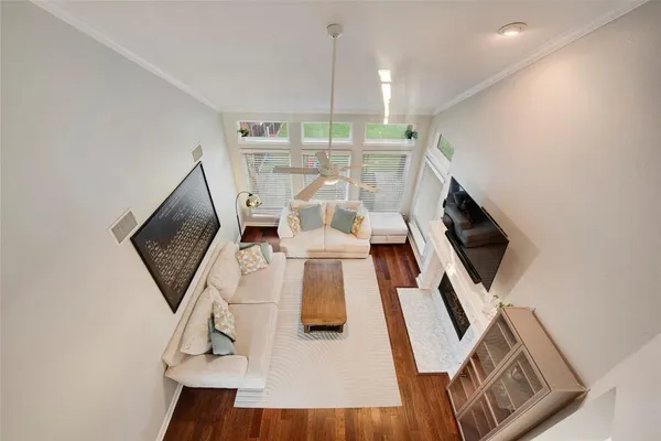 a bedroom with a bed and a chair with the potted plant