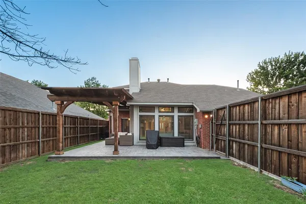 a view of a house with a yard and porch