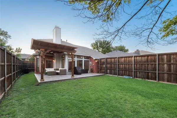 a view of a backyard with a trees