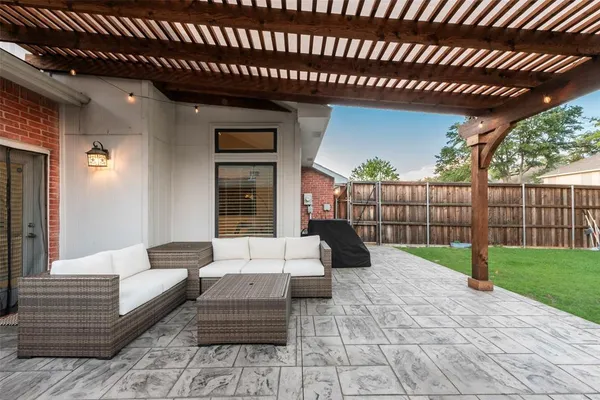 a view of a patio with couches table and chairs