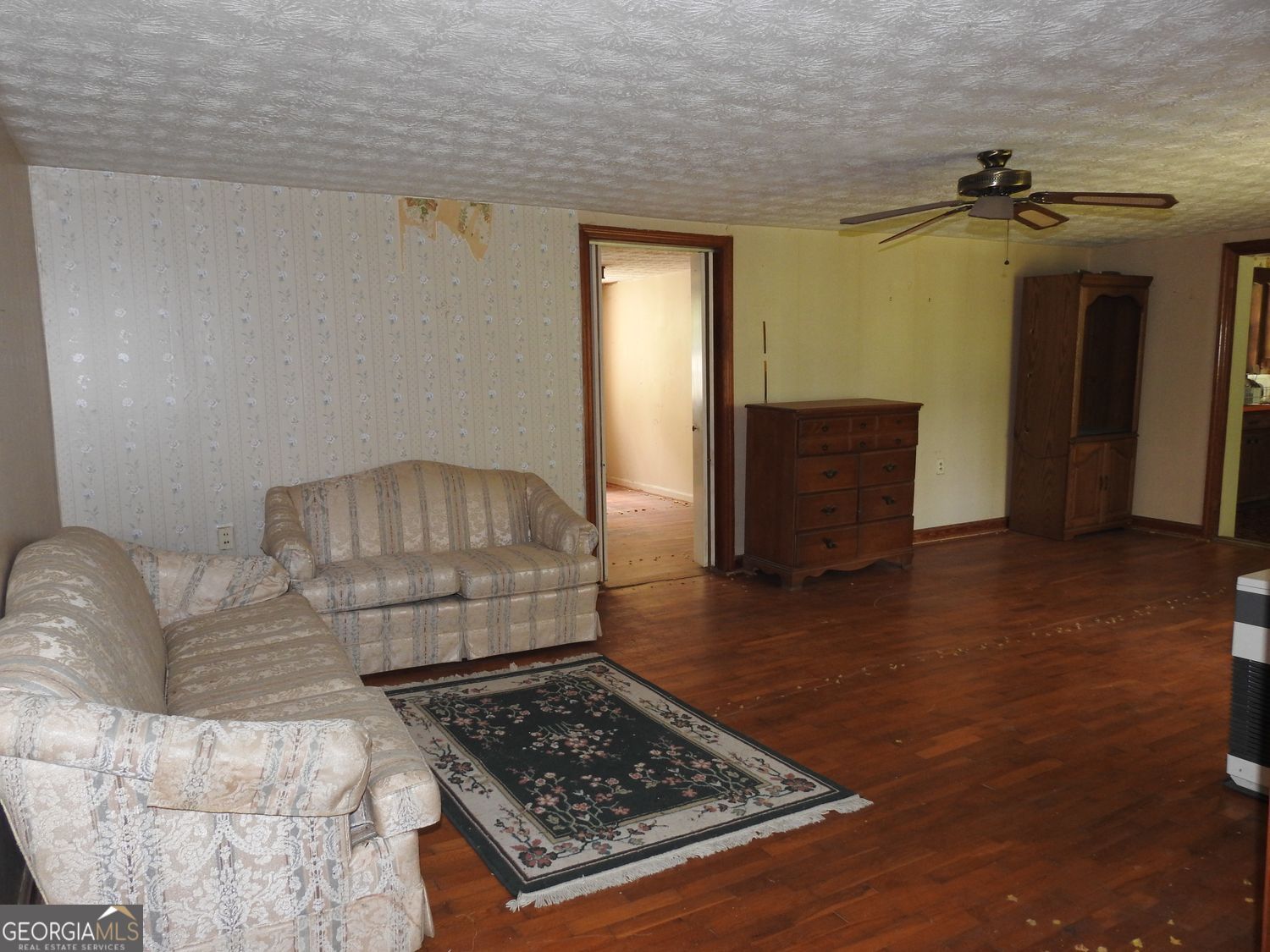 333 Lickskillet Road Epworth, GA 30541 - Photo 11 of 38 a living room with furniture and a rug