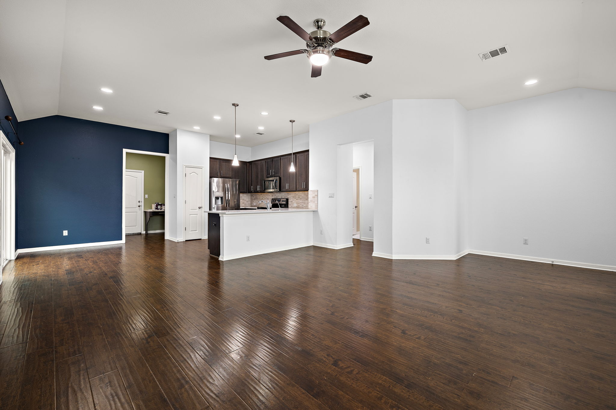 706 Coconut Grove Street Pflugerville, TX 78660 - Photo 6 of 23 Enjoy an open and airy living and dining area that feels perfect for gathering with friends, hosting dinners, or enjoying quiet evenings at home.