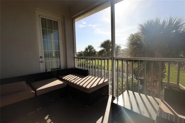 a view of balcony with wooden floor and outdoor seating