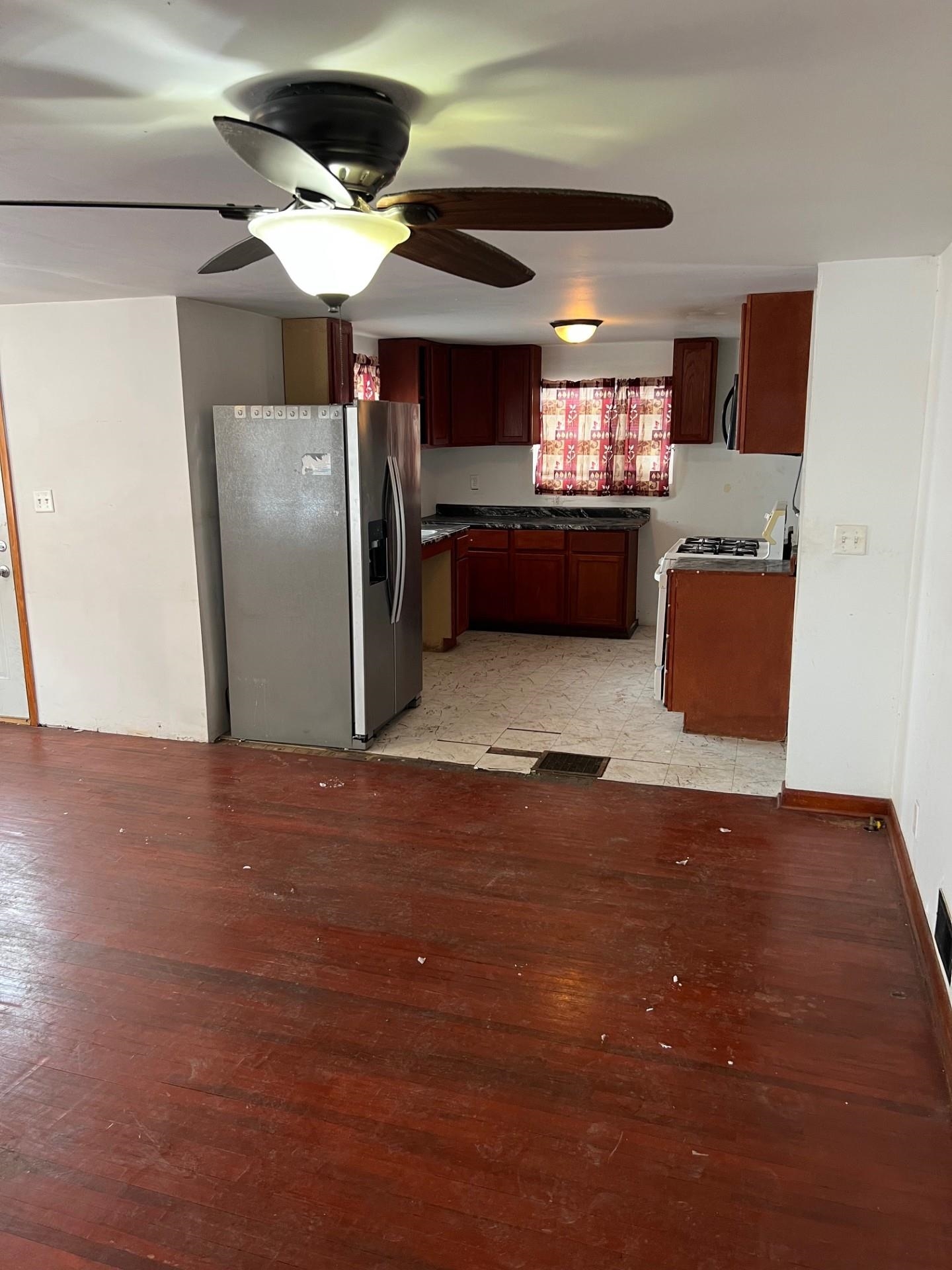 860 North Kent Road Kent, IL 61044 - Photo 4 of 11 a kitchen with refrigerator and window