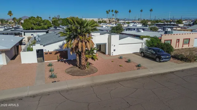 an aerial view of a house with outdoor space