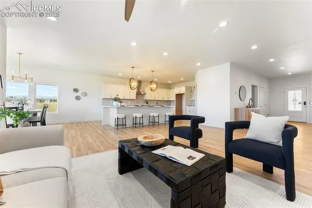 a living room with furniture and a table