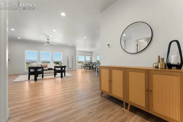a lobby with furniture and wooden floor
