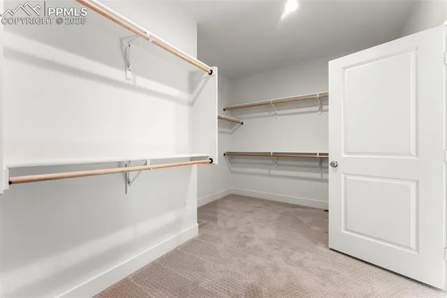 a spacious bathroom with a double vanity sink and a mirror