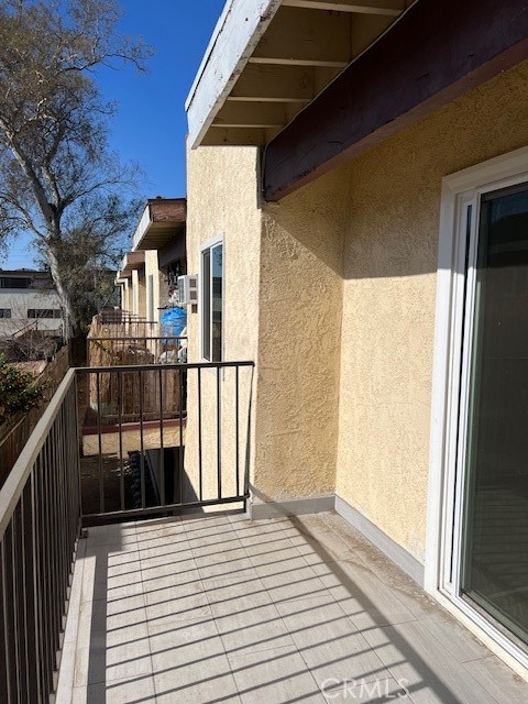 839 North Summit Avenue Pasadena, CA 91103 - Photo 5 of 27 a view of a balcony with wooden floor and fence