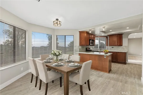 a view of a dining room with furniture window and outside view