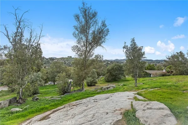 a view of a house with a big yard
