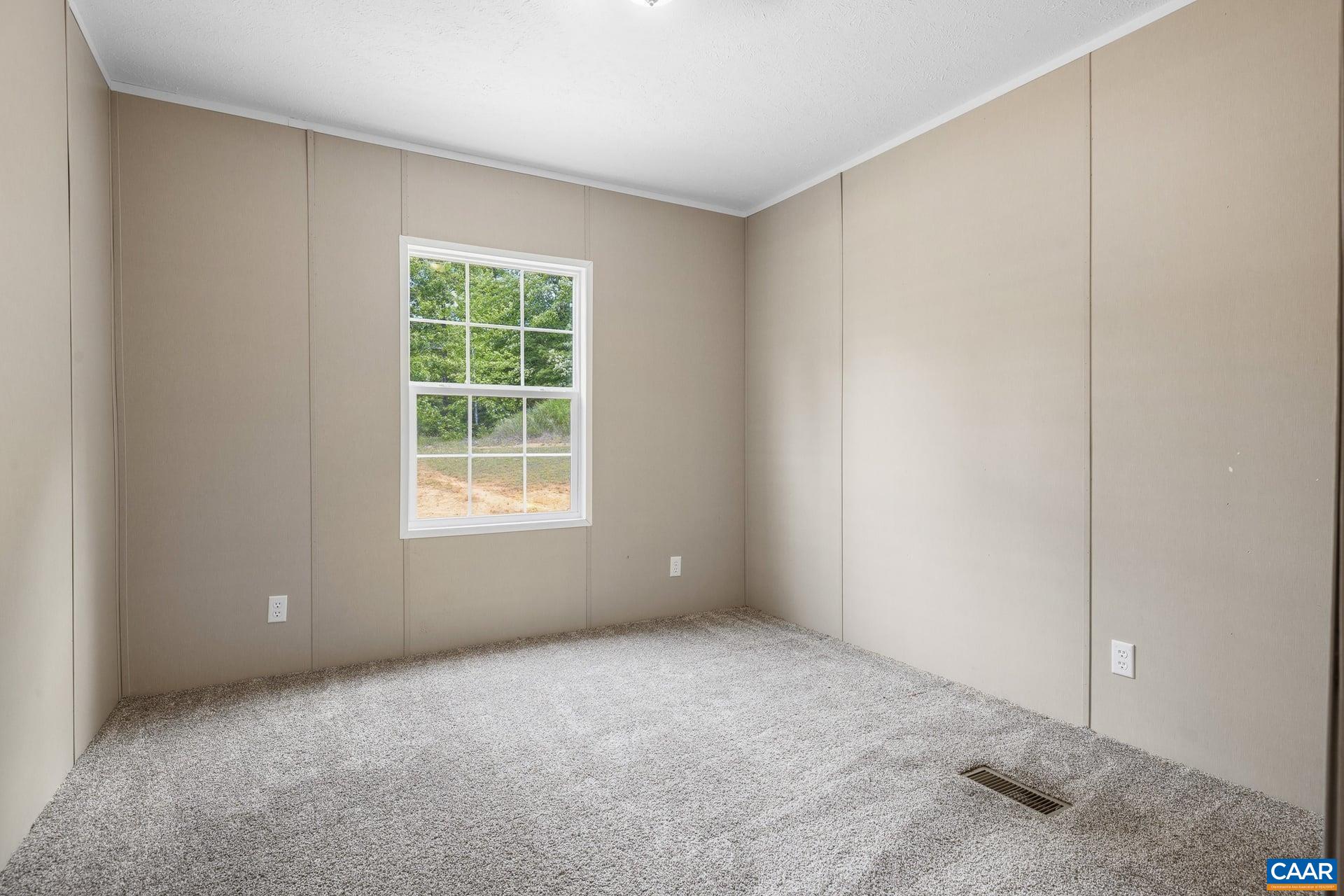 1920 Waltons Store Road Louisa, VA 23093 - Photo 26 of 43 a view of an empty room with a window