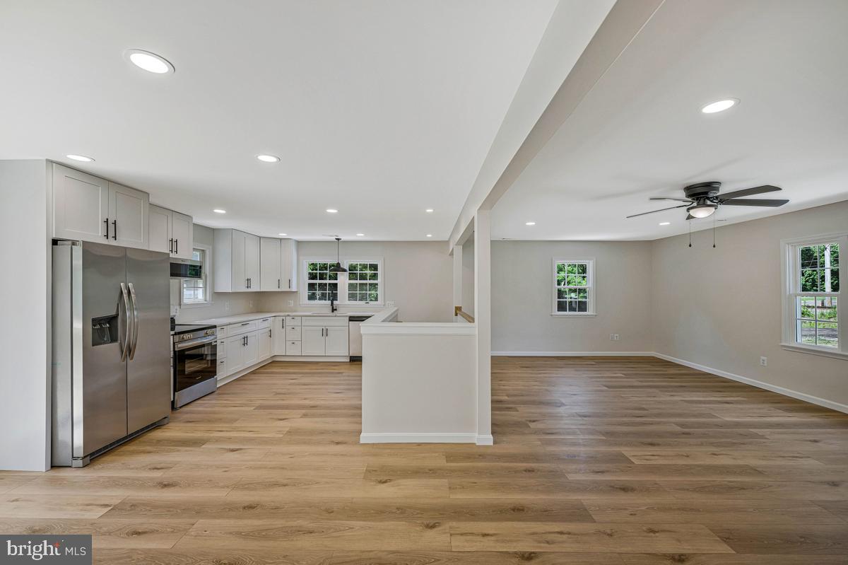 13304 Cherry Tree Crossing Road Brandywine, MD 20613 - Photo 32 of 32 Spacious, modern kitchen and living area.