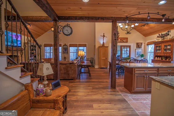 a kitchen with stainless steel appliances granite countertop lots of counter top and a stove