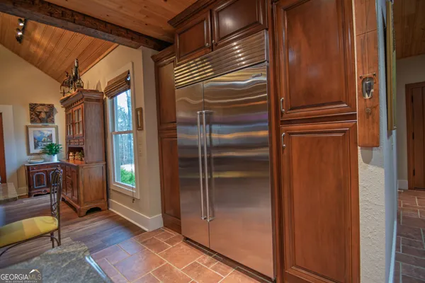 a work room with furniture and a window