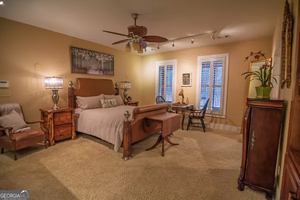 a bathroom with a toilet and a wooden door