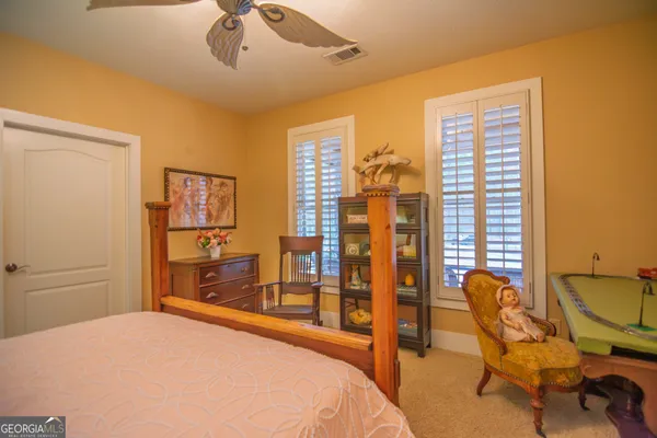 a view of a house with a swimming pool and a yard