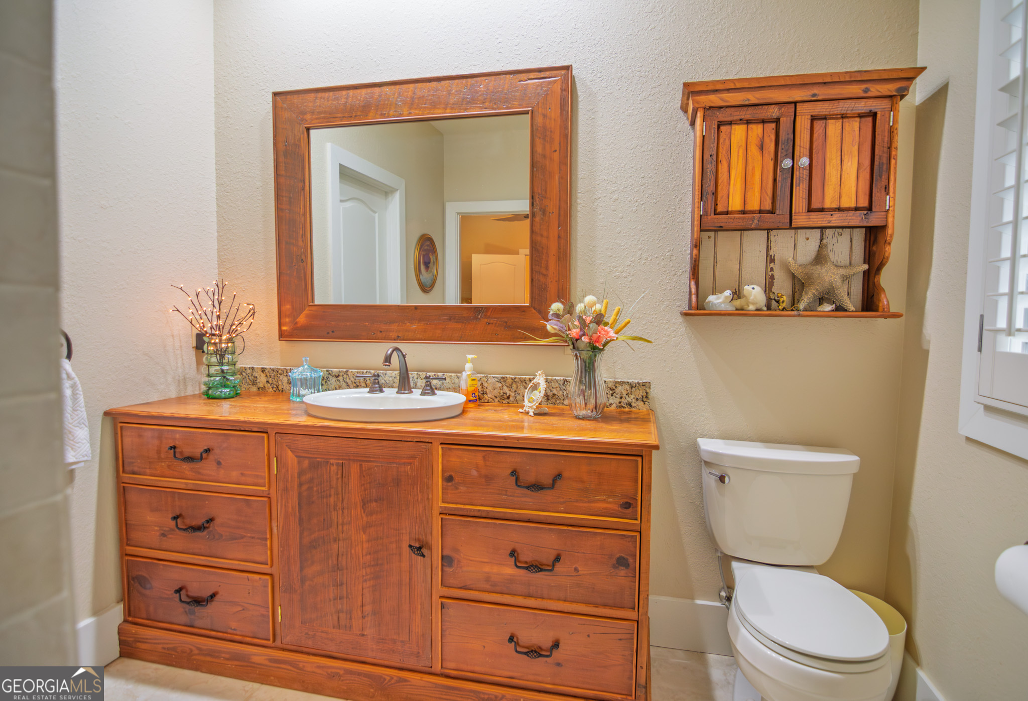1578 Highway 208 Hamilton, GA 31811 - Photo 51 of 82 a bathroom with a toilet a sink a mirror and a window