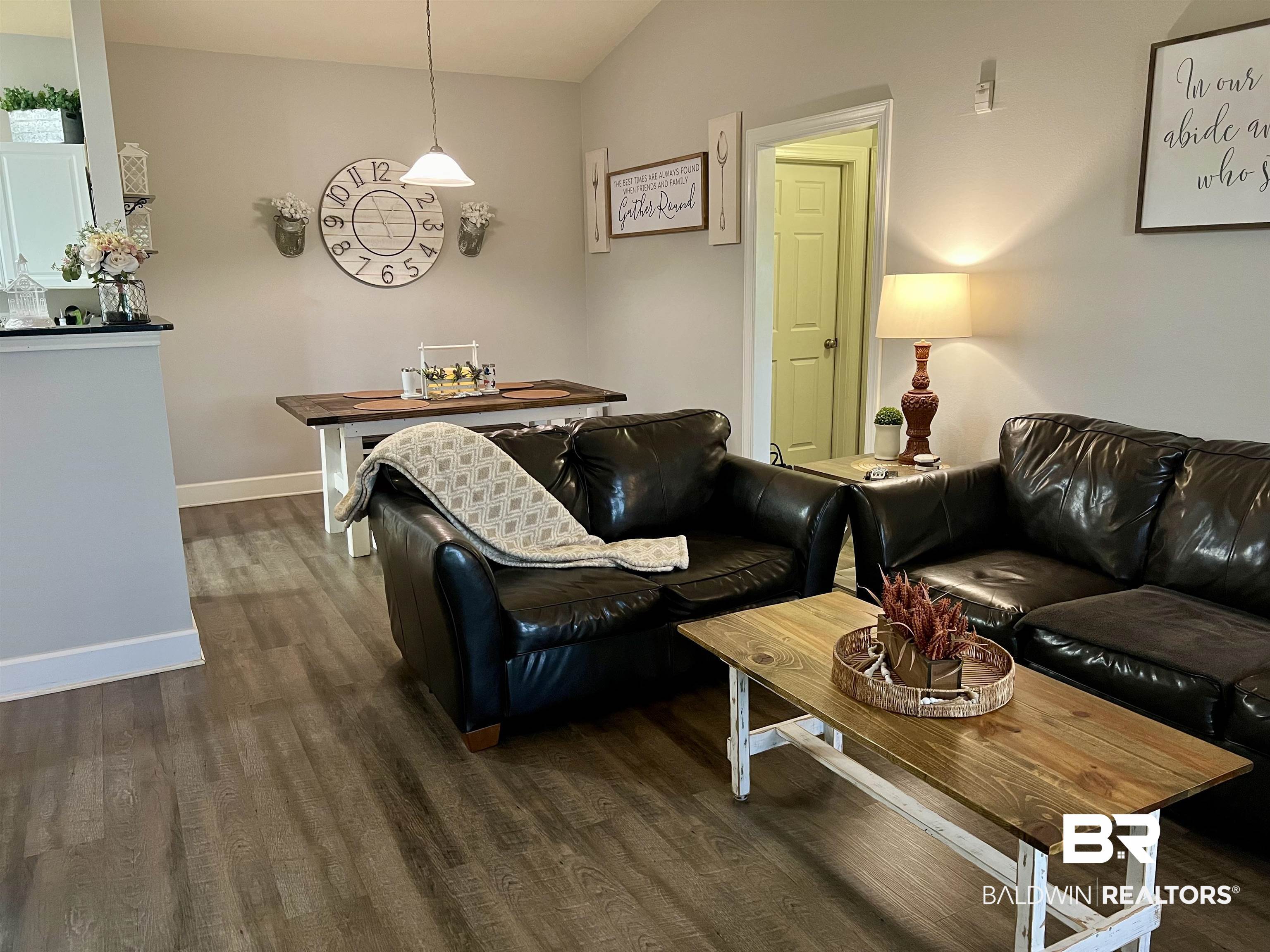 450 Park Avenue, Unit 808 Foley, AL 36535 - Photo 5 of 38 Living room featuring lofted ceiling and dark hardwood / wood-style floors