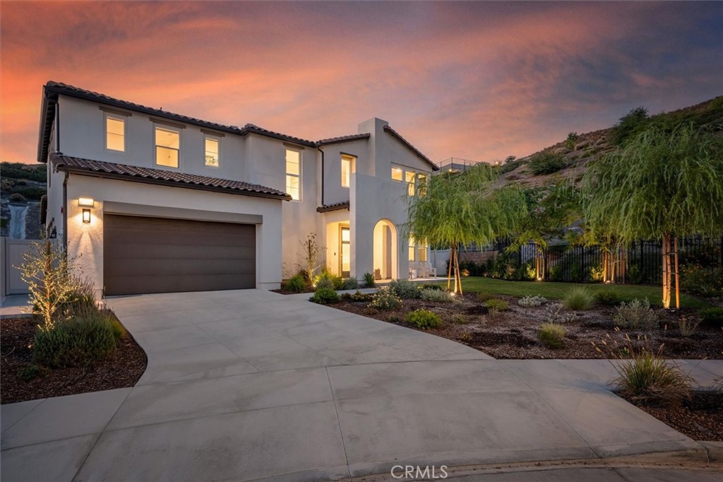 17701 Ridgeline Court Saugus, CA 91350 - Photo 1 of 61 a front view of a house with a yard and garage