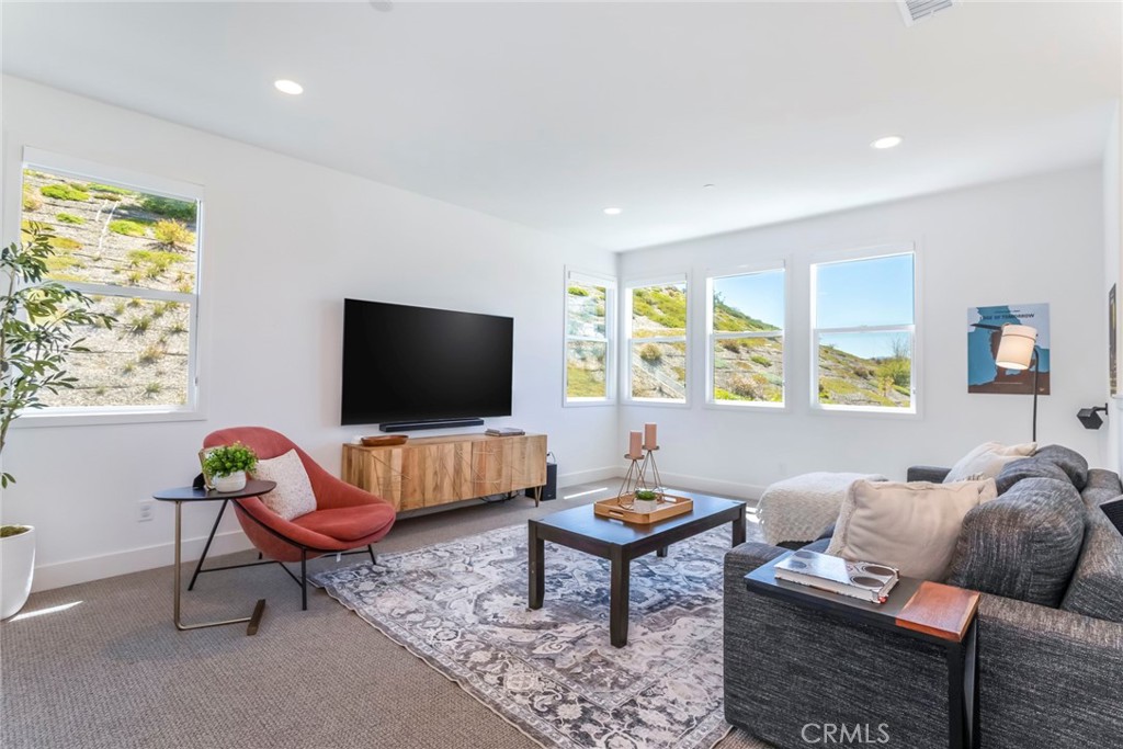 17701 Ridgeline Court Saugus, CA 91350 - Photo 20 of 61 a living room with furniture and a flat screen tv
