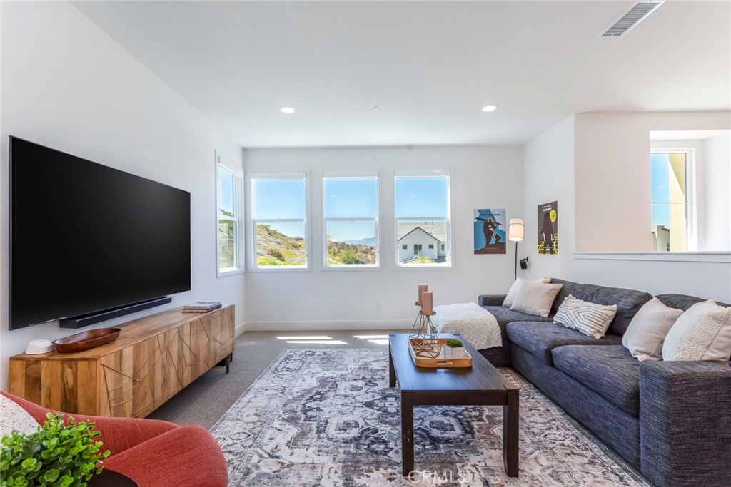 17701 Ridgeline Court Saugus, CA 91350 - Photo 21 of 61 a living room with furniture and a flat screen tv