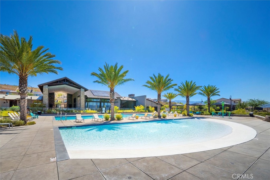 17701 Ridgeline Court Saugus, CA 91350 - Photo 48 of 61 a view of swimming pool with outdoor seating and house in the background