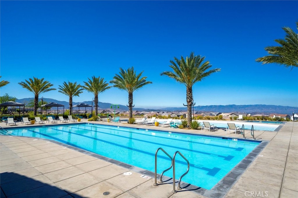 17701 Ridgeline Court Saugus, CA 91350 - Photo 54 of 61 a view of a swimming pool with a table and chairs