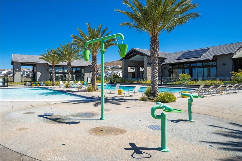 17701 Ridgeline Court Saugus, CA 91350 - Photo 58 of 61 a patio with a table and chairs under an umbrella