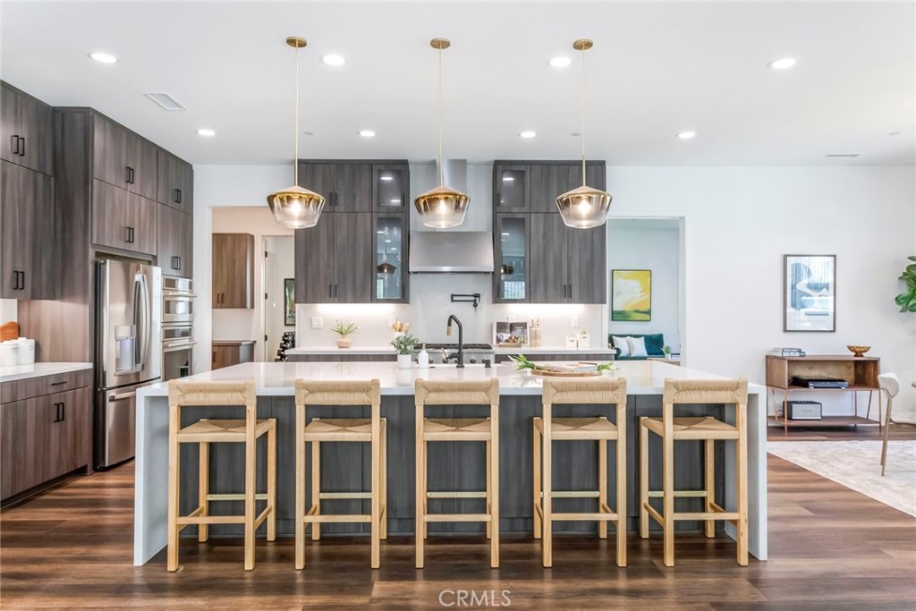 17701 Ridgeline Court Saugus, CA 91350 - Photo 7 of 61 a large kitchen with a table and chairs