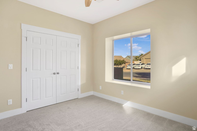 1570 South Rio Virgin Drive Washington, UT 84780 - Photo 45 of 71 Unfurnished bedroom featuring light carpet, a closet, and ceiling fan