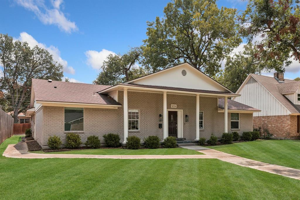 5216 Ashbrook Road Dallas, TX 75227 - Photo 28 of 28 Brick exterior with a covered entry, four columns, and a gabled roof