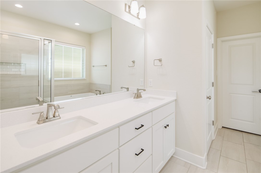 4302 Appalachian Trail Bryan, TX 77802 - Photo 13 of 23 Full bathroom featuring a bath, double vanity, a s