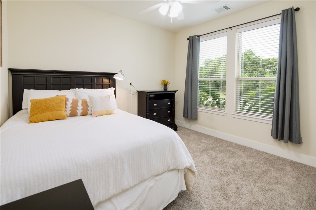 4302 Appalachian Trail Bryan, TX 77802 - Photo 14 of 23 Carpeted bedroom featuring baseboards and a ceilin