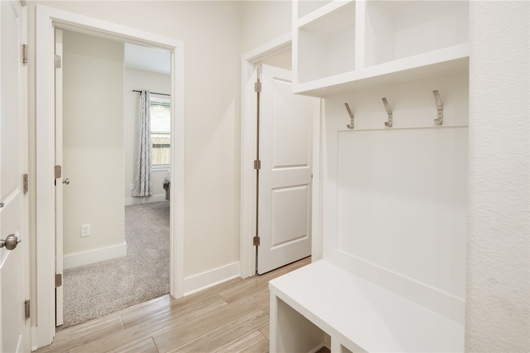 4302 Appalachian Trail Bryan, TX 77802 - Photo 18 of 23 Mudroom with light wood-style flooring and baseboa