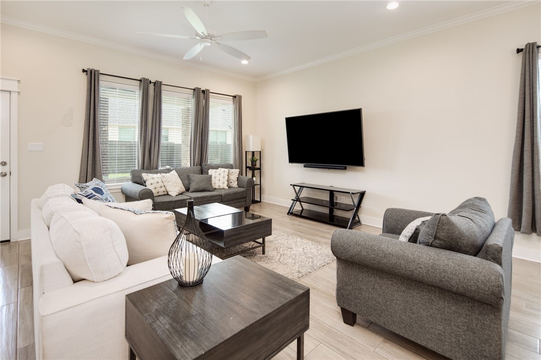 4302 Appalachian Trail Bryan, TX 77802 - Photo 4 of 23 Living room featuring a ceiling fan, ornamental mo