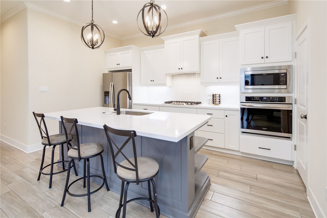 4302 Appalachian Trail Bryan, TX 77802 - Photo 7 of 23 Kitchen with stainless steel appliances, a center