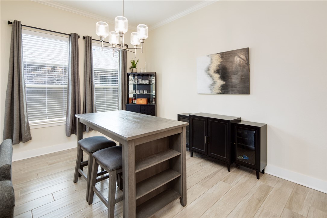 4302 Appalachian Trail Bryan, TX 77802 - Photo 10 of 23 Dining area with a chandelier, baseboards, crown m