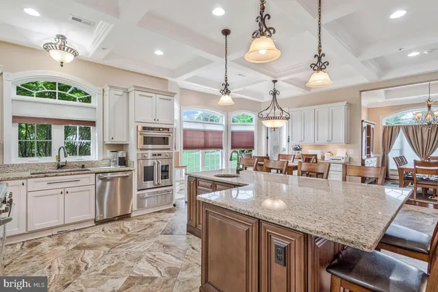 a kitchen with sink stove and wooden cabinets